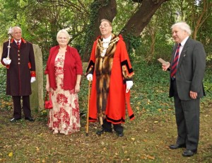 Mayors are required to 'robe up' for special civic occasions. Here Mayor Loveridge helps rededicate a section of Eastover cemetry